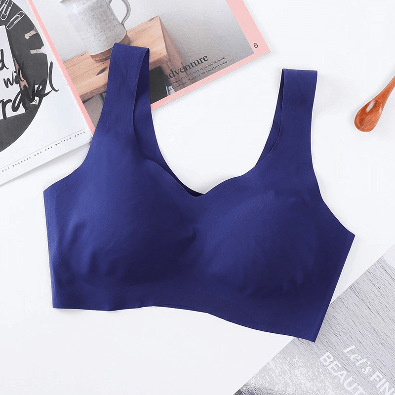 Navy blue seamless sports bra with wide straps and padding, perfect for fitness and comfort.
